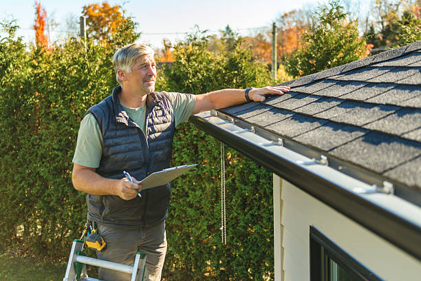Professional Storm Damage Roof Repair technician working in Whiting, IN
